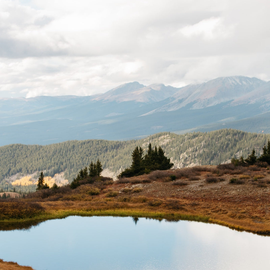 Mountain reflection in alpine lake.