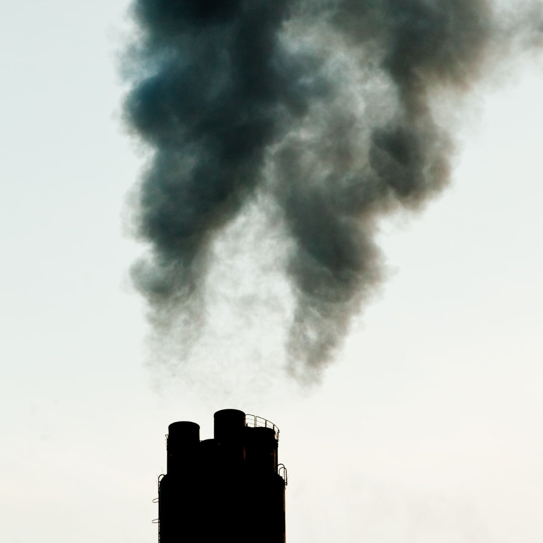 Factory chimney emitting smoke.