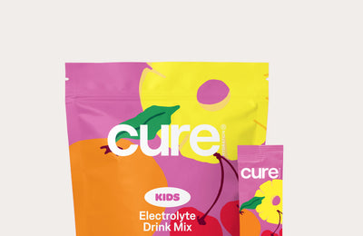 cure KIDS Electrolyte Drink Mix — Fruit Punch pouch and single-serve stick