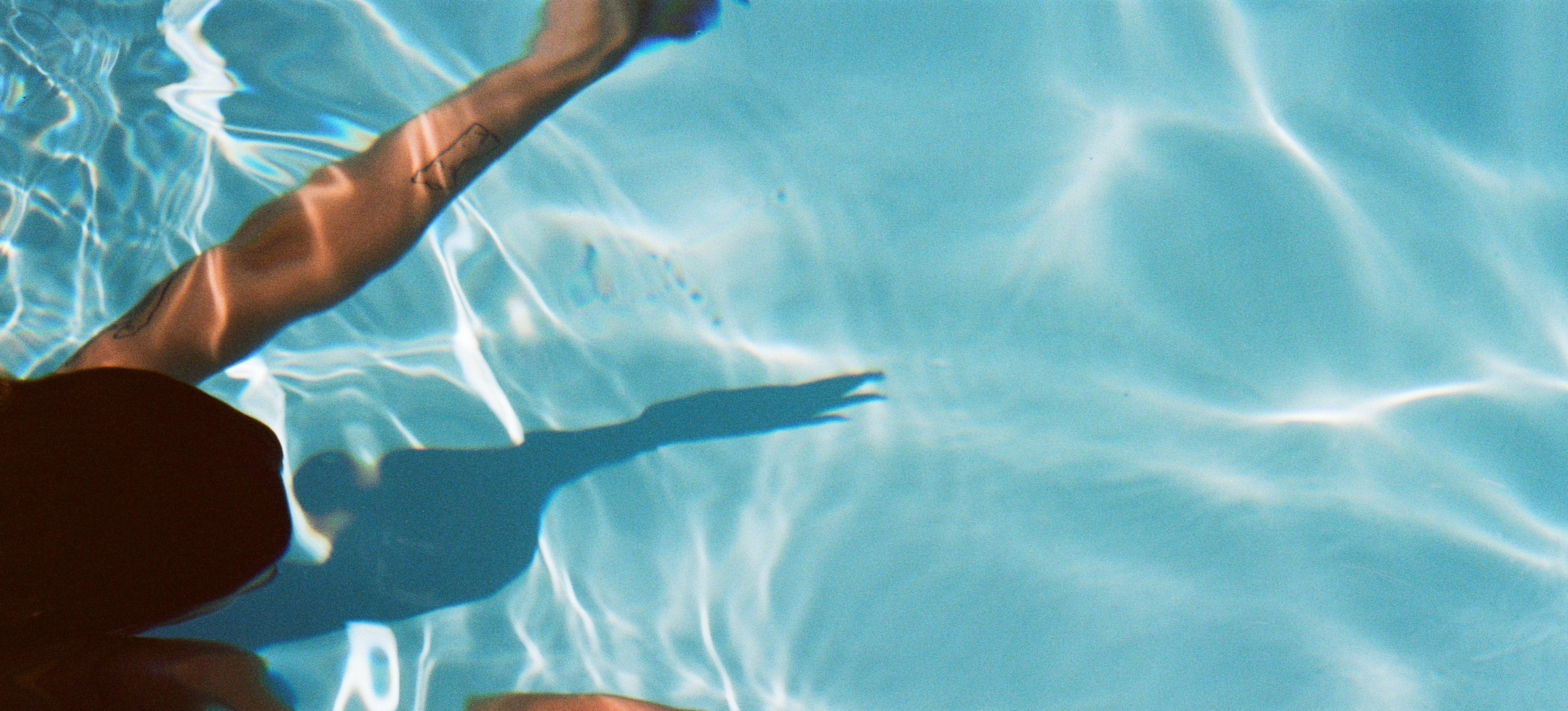 girl shadow swimming in pool