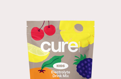 cure KIDS Electrolyte Drink Mix Variety Pack pouch with cherry, lemon, grape and raspberry illustrations.