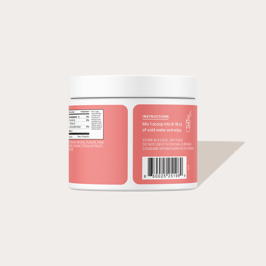 Rear close-up of Strawberry Kiwi bulk jar showcasing instructions panel, nutrition facts and barcode with pale beige background
