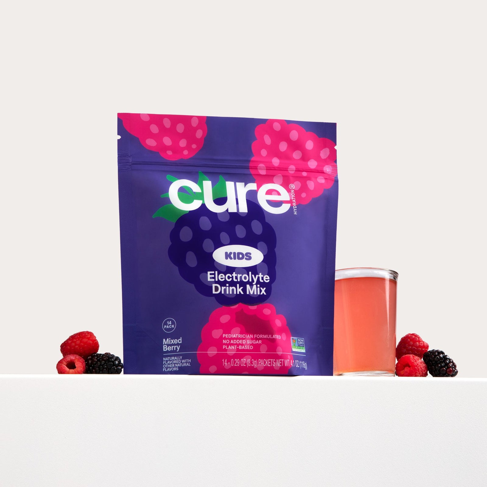 Front view of Mixed Berry kids electrolyte drink mix pouch showcasing Cure logo and a glass of pink drink on white background