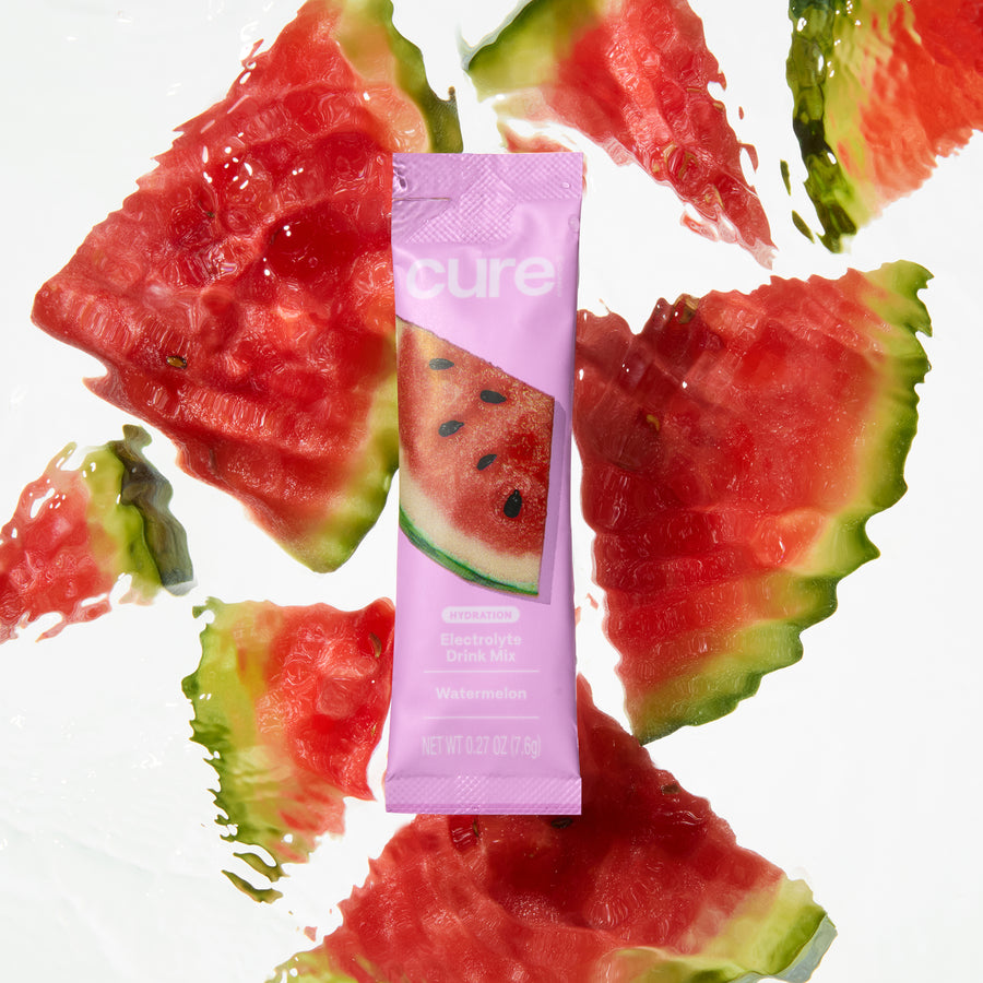 Front view of Watermelon electrolyte drink mix packet showcasing pink packaging with watermelon slices on a white background
